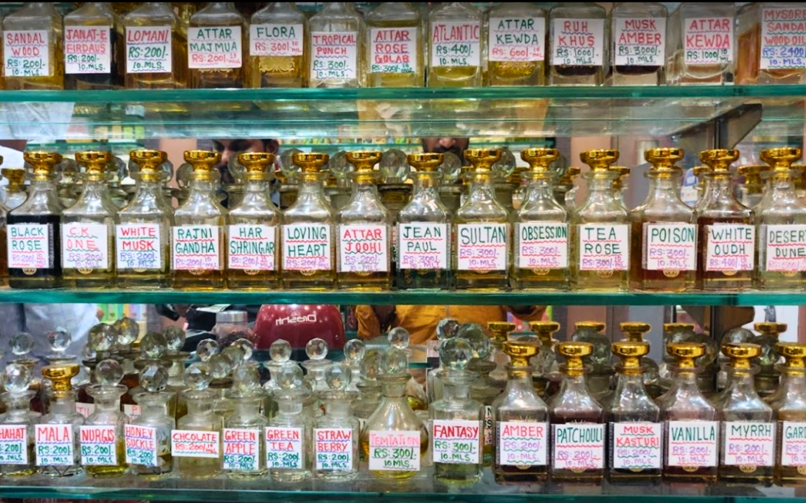Showcasing a lot of ittar bottles in shop stack Perfume ecommerce website portfolio of IttarStore